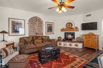The living area is modern with a rustic flair and southwestern charm